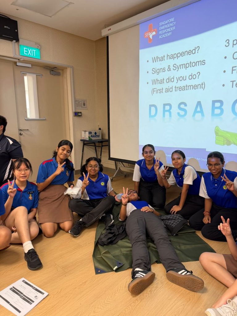 Students attending first aid training, learning emergency response