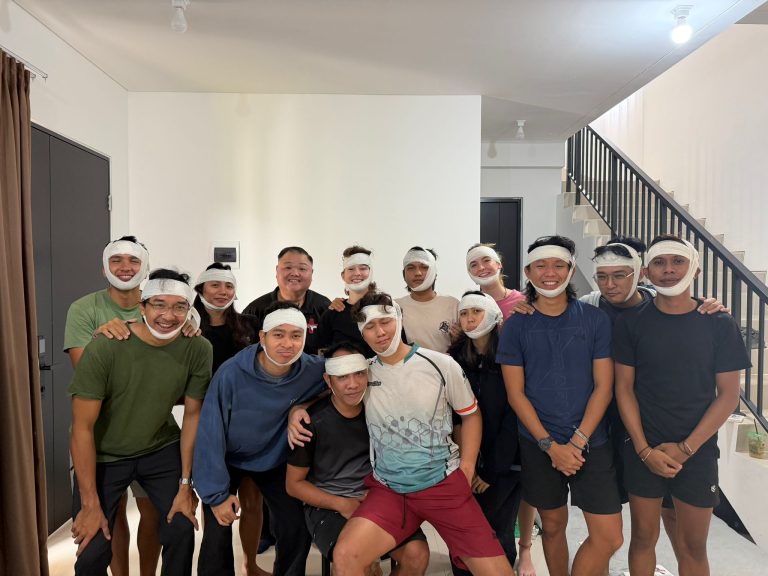SERA First Aid training participants doing bandaging together